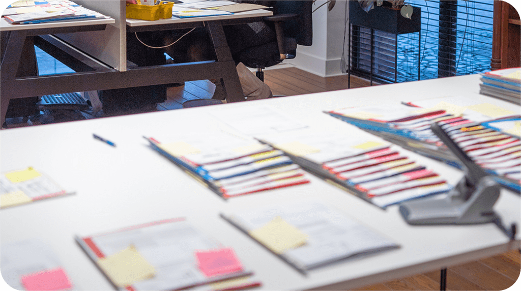 A photo of the work table for the Letter of Credit specialists at Elceco. Visible various Letters of Credit.